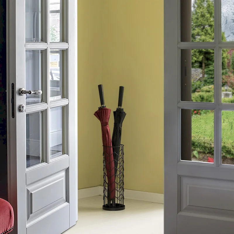 Paragüero negro redondo de diseño horizontal para interiores y exteriores, con bandeja de goteo